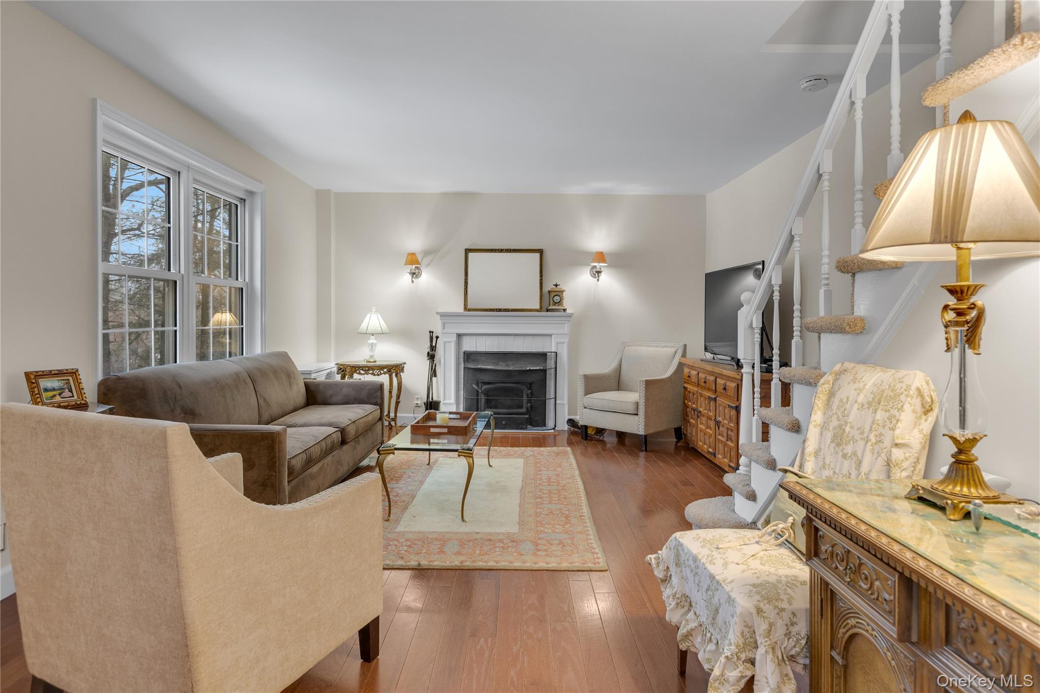 72 Daly Road East Northport, NY 11731 - Photo 2 of 18 a living room with furniture and a fireplace