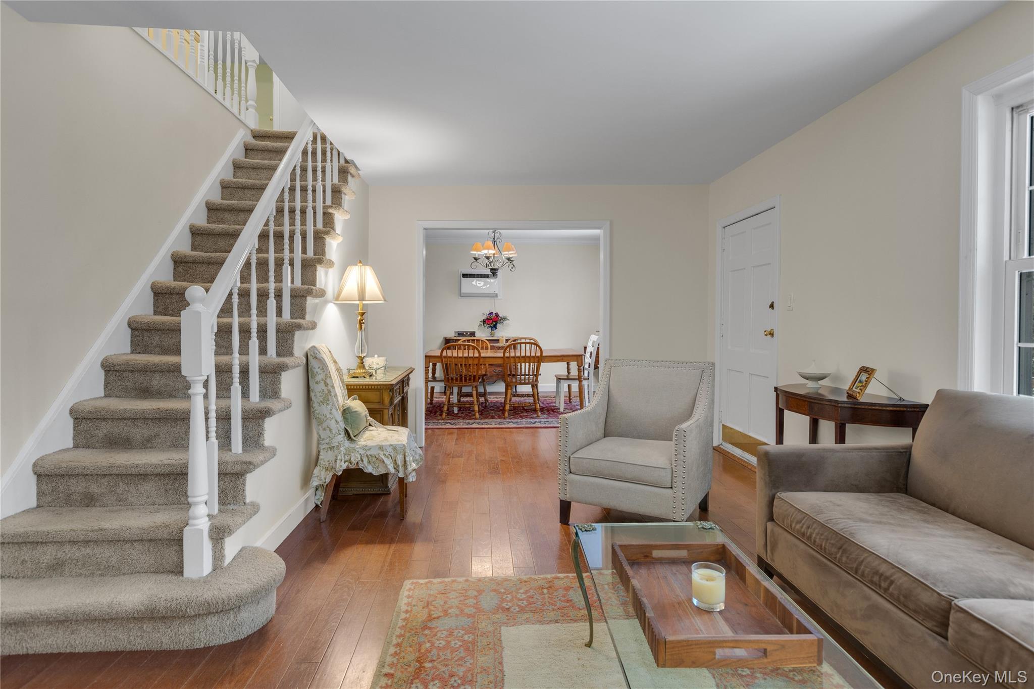 72 Daly Road East Northport, NY 11731 - Photo 3 of 18 a living room with furniture and a stair