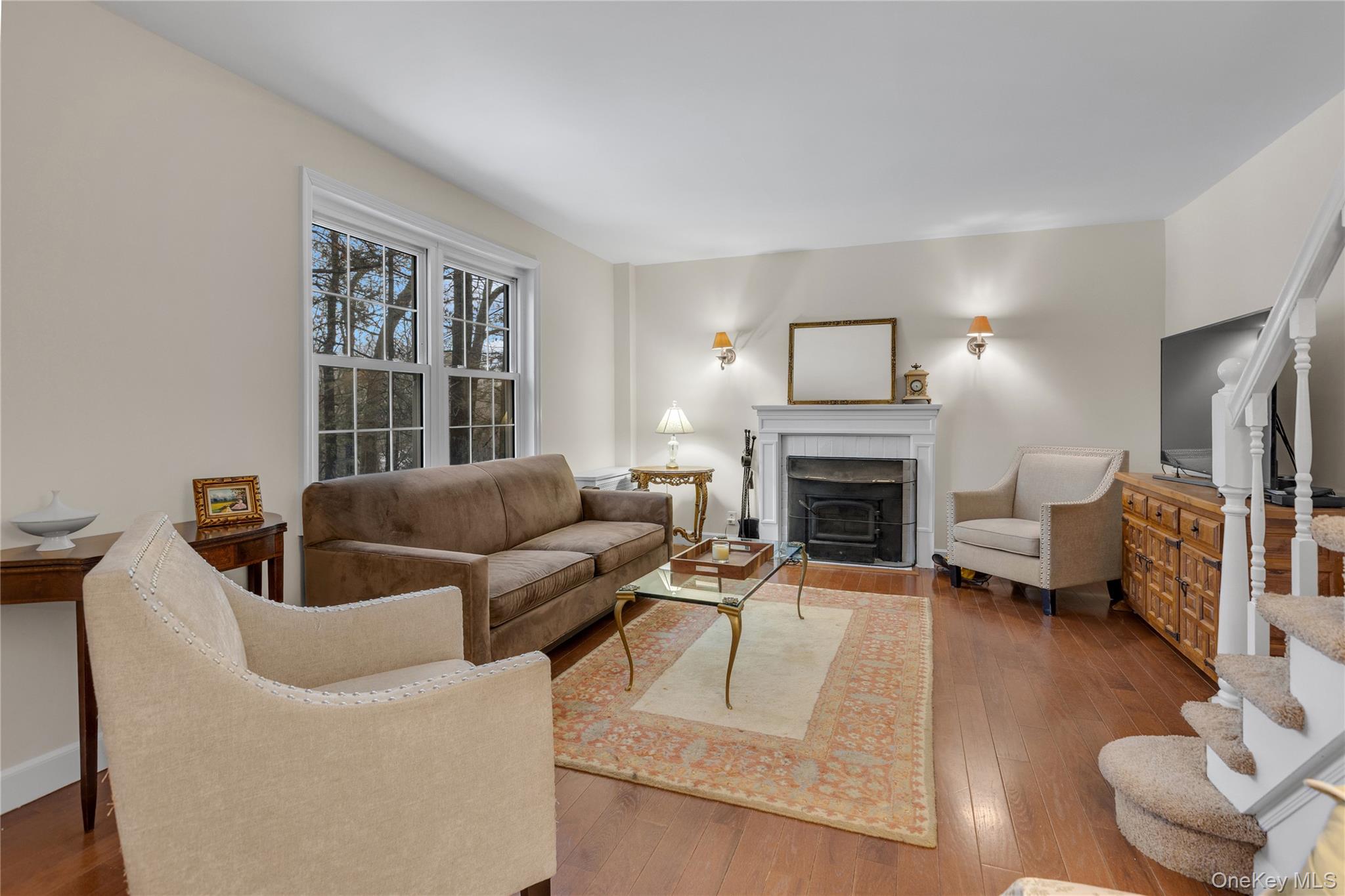 72 Daly Road East Northport, NY 11731 - Photo 4 of 18 a living room with furniture and a fireplace