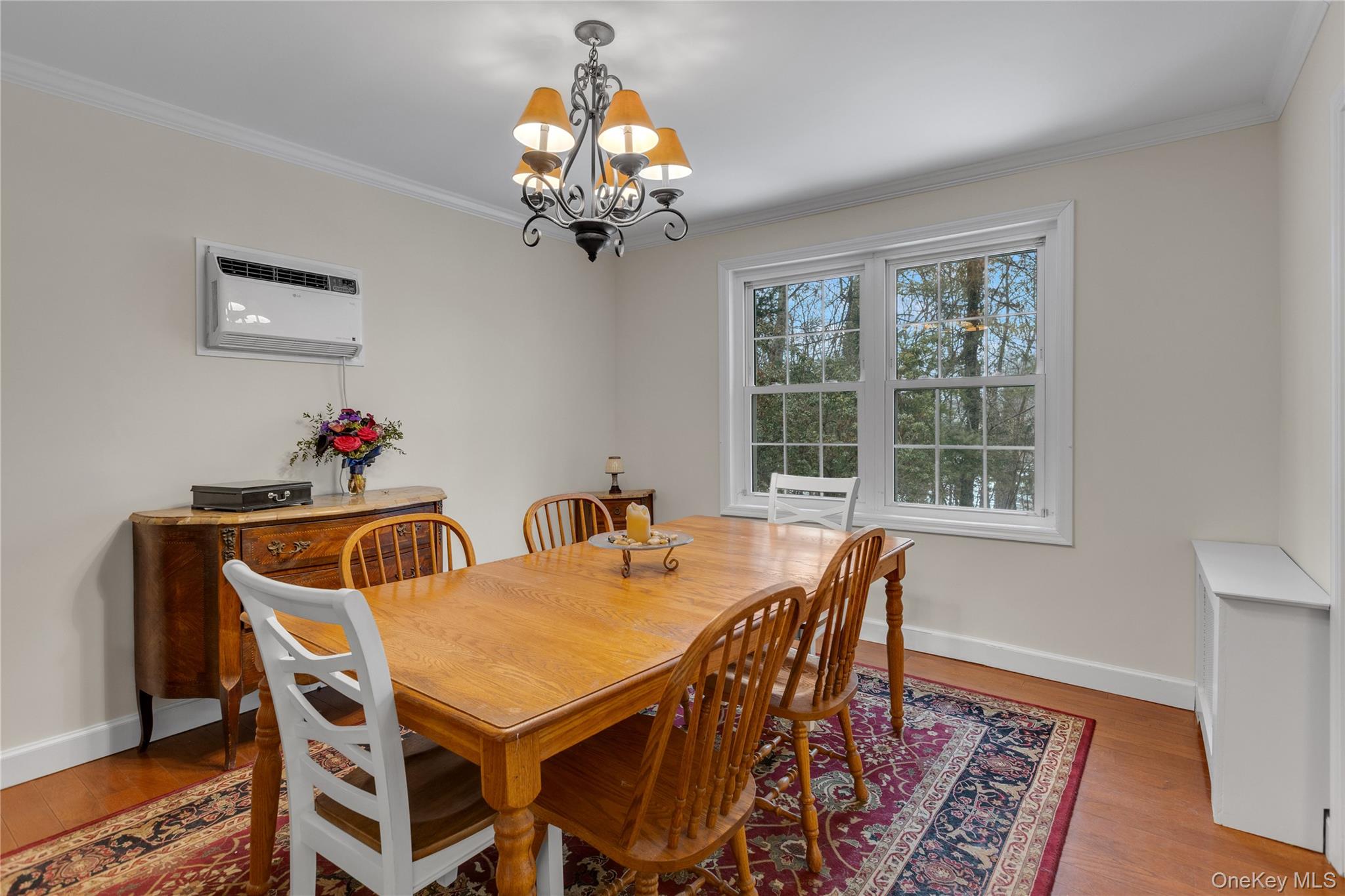 72 Daly Road East Northport, NY 11731 - Photo 5 of 18 a view of a dining room with furniture wooden floor and chandelier