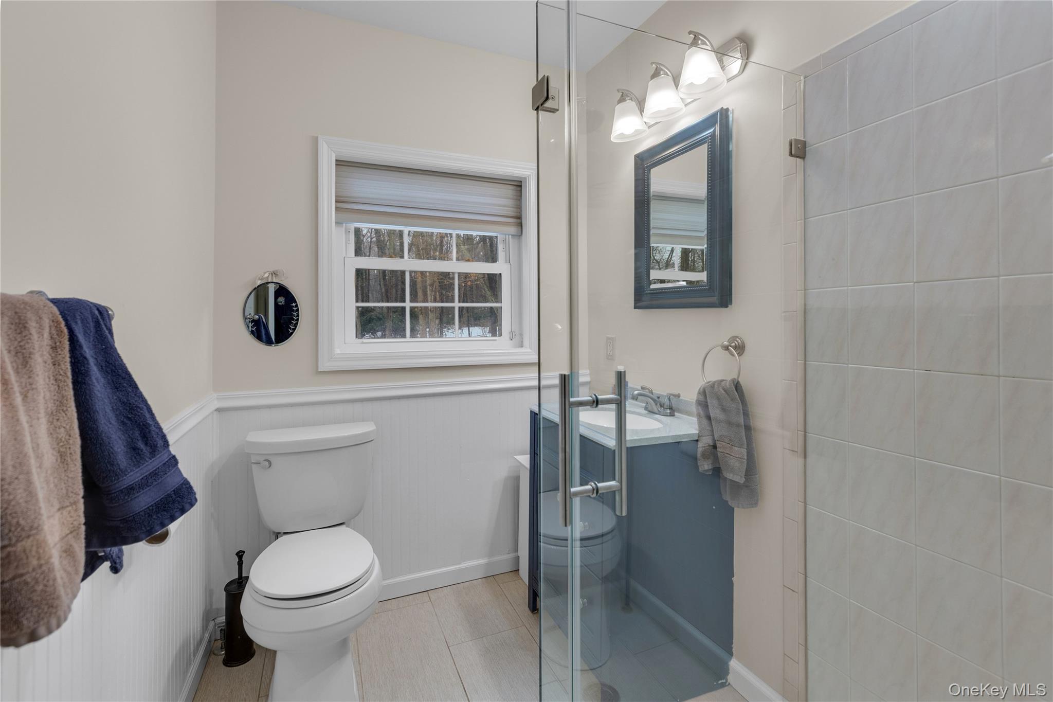 72 Daly Road East Northport, NY 11731 - Photo 7 of 18 a bathroom with a toilet a sink and mirror
