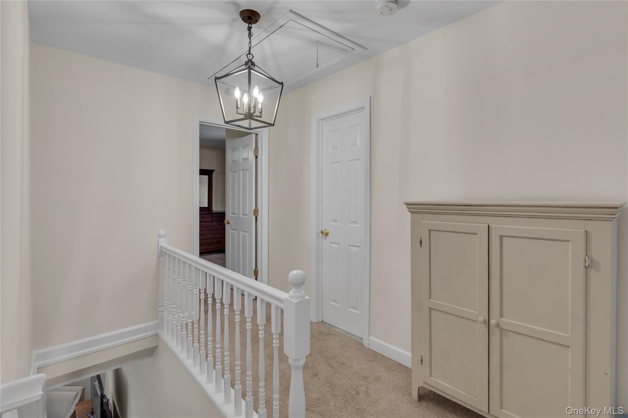 72 Daly Road East Northport, NY 11731 - Photo 10 of 18 a view of a hallway with wooden floor and entryway