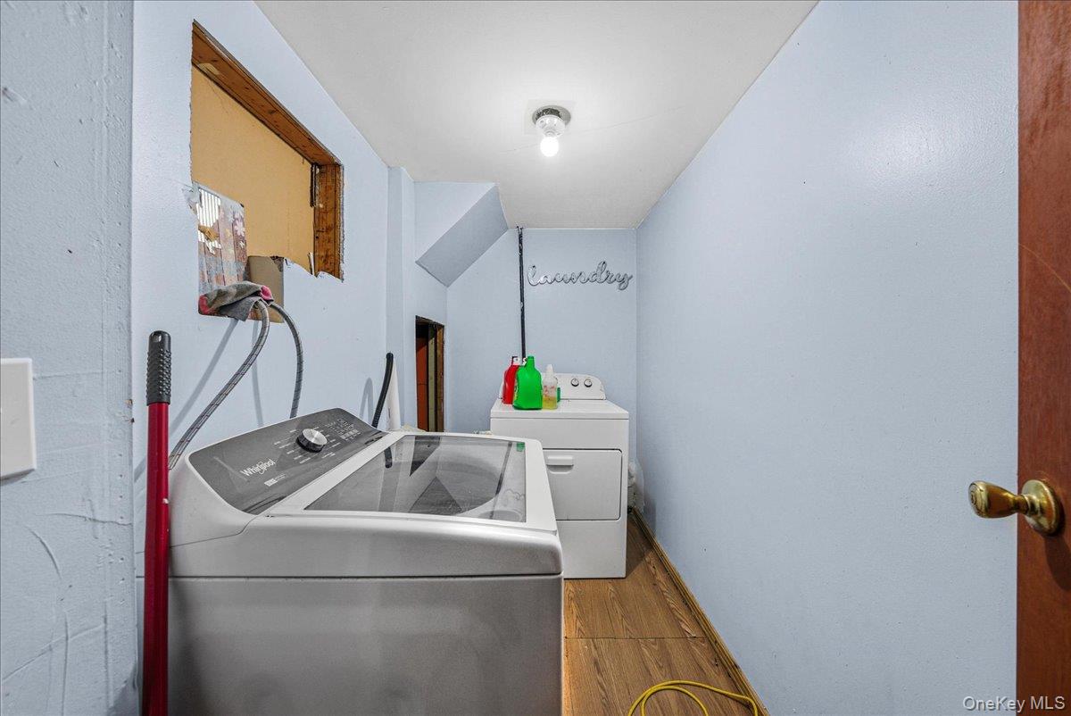 128-66 238th Street Queens, NY 11422 - Photo 17 of 25 a utility room with dryer and washer