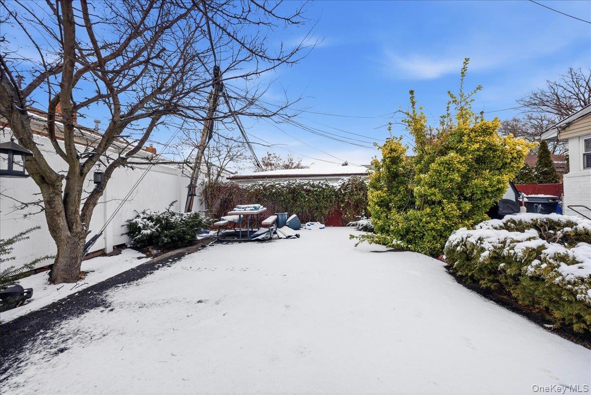 128-66 238th Street Queens, NY 11422 - Photo 23 of 25 a view of a backyard of a house