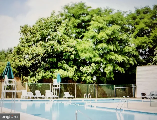 a view of swimming pool from a balcony