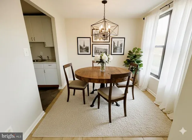 a view of a dining room with furniture and window