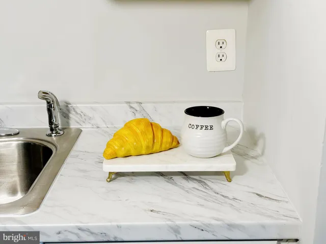 a view of a swimming pool and lounge chair