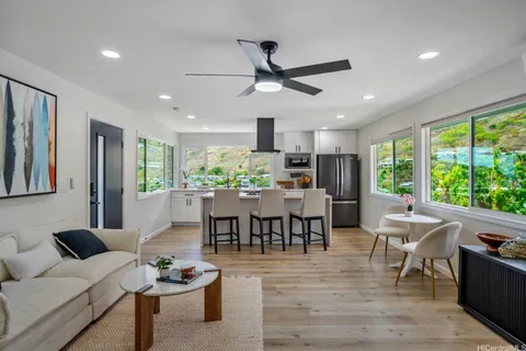 a view of a dining room with furniture window and outside view