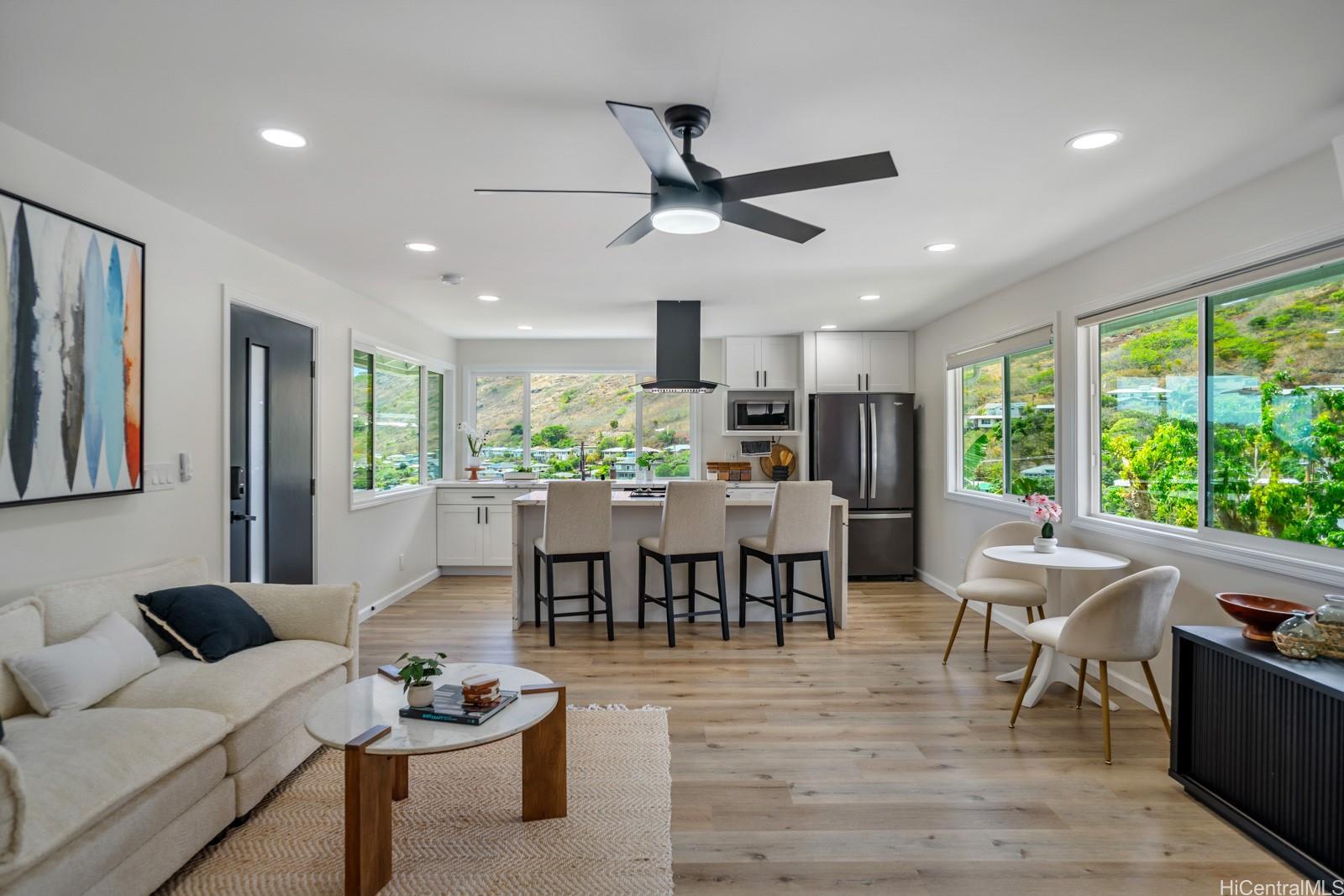 a view of a dining room with furniture window and outside view