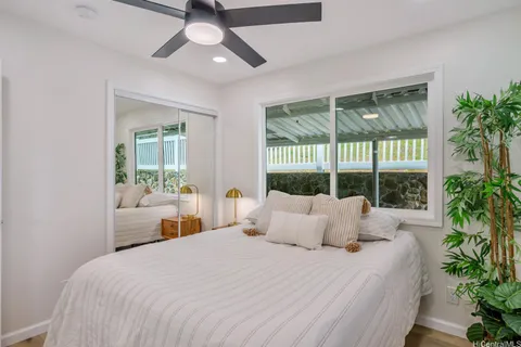 a bedroom with a large bed and a large window