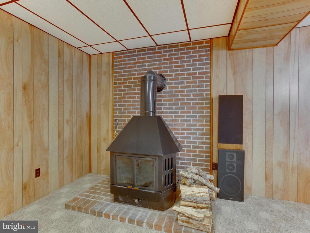 5040 Hardesty Road Sunderland, MD 20689 - Photo 23 of 44 Beautiful wood stove in rec room