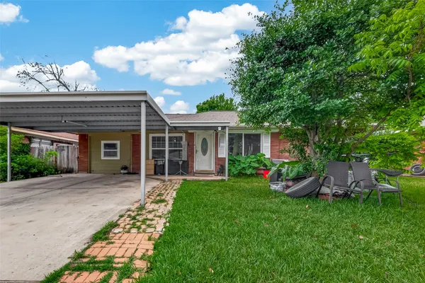 front view of a house with a yard