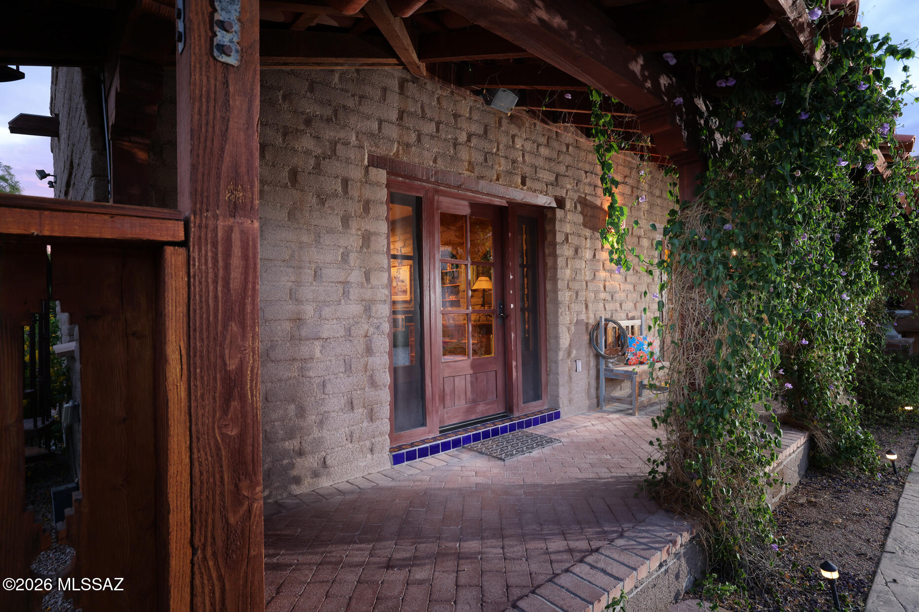 11725 East Spanish Ridge Place Tucson, AZ 85730 - Photo 37 of 51 a view of a door of the house and trees