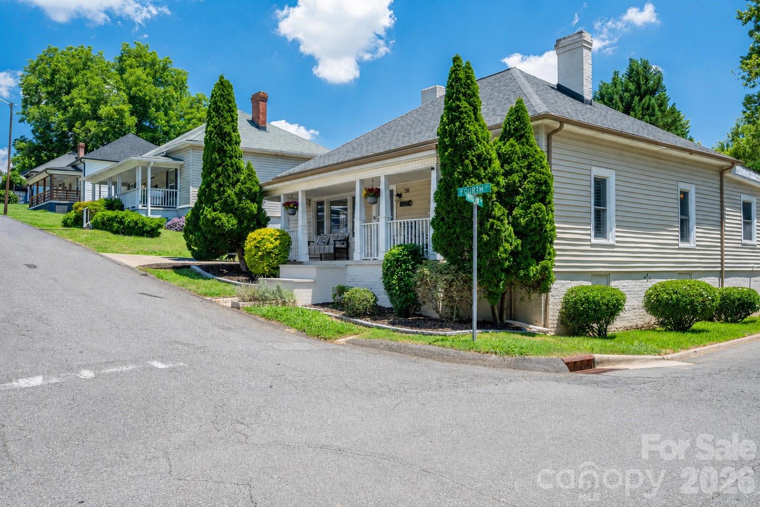 58 Fourth Street Cramerton, NC 28032 - Photo 10 of 44 front view of house with a yard and potted plants