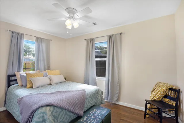 a bedroom with a bed and a chair