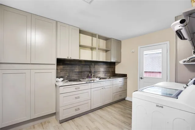 a kitchen with a sink and cabinets