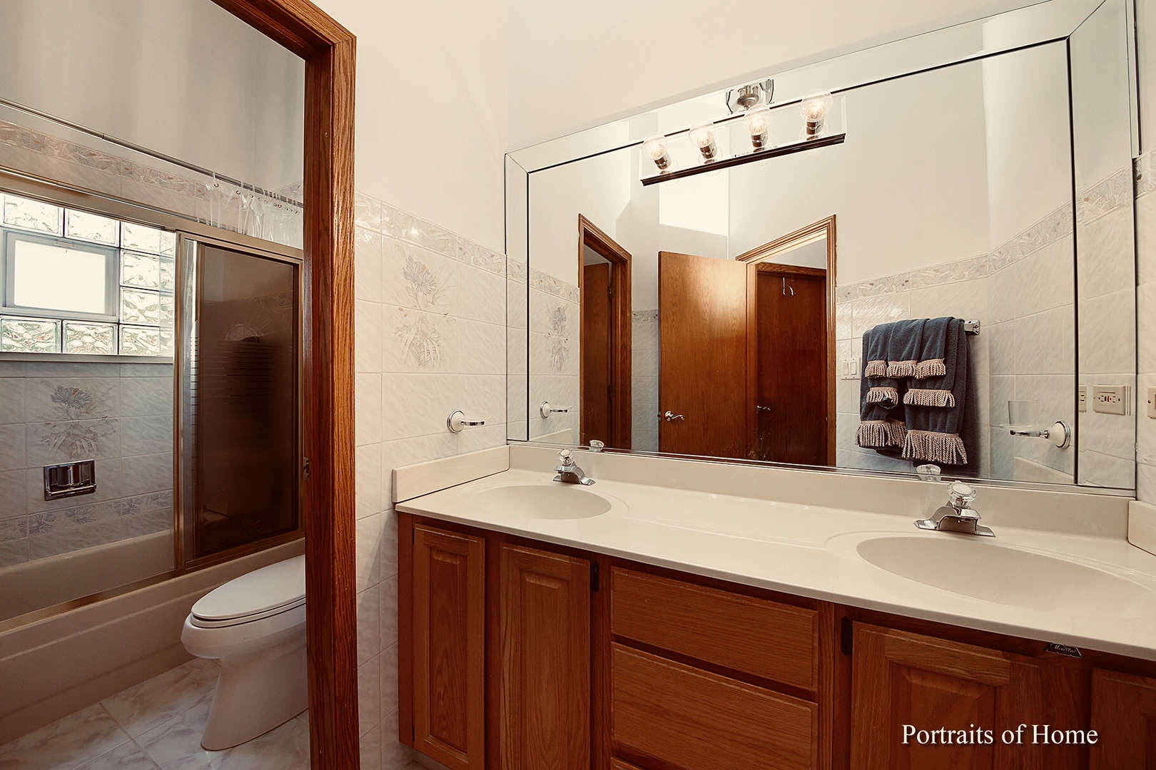 1220 Itasca Road Addison, IL 60101 - Photo 14 of 26 a bathroom with a sink and a mirror