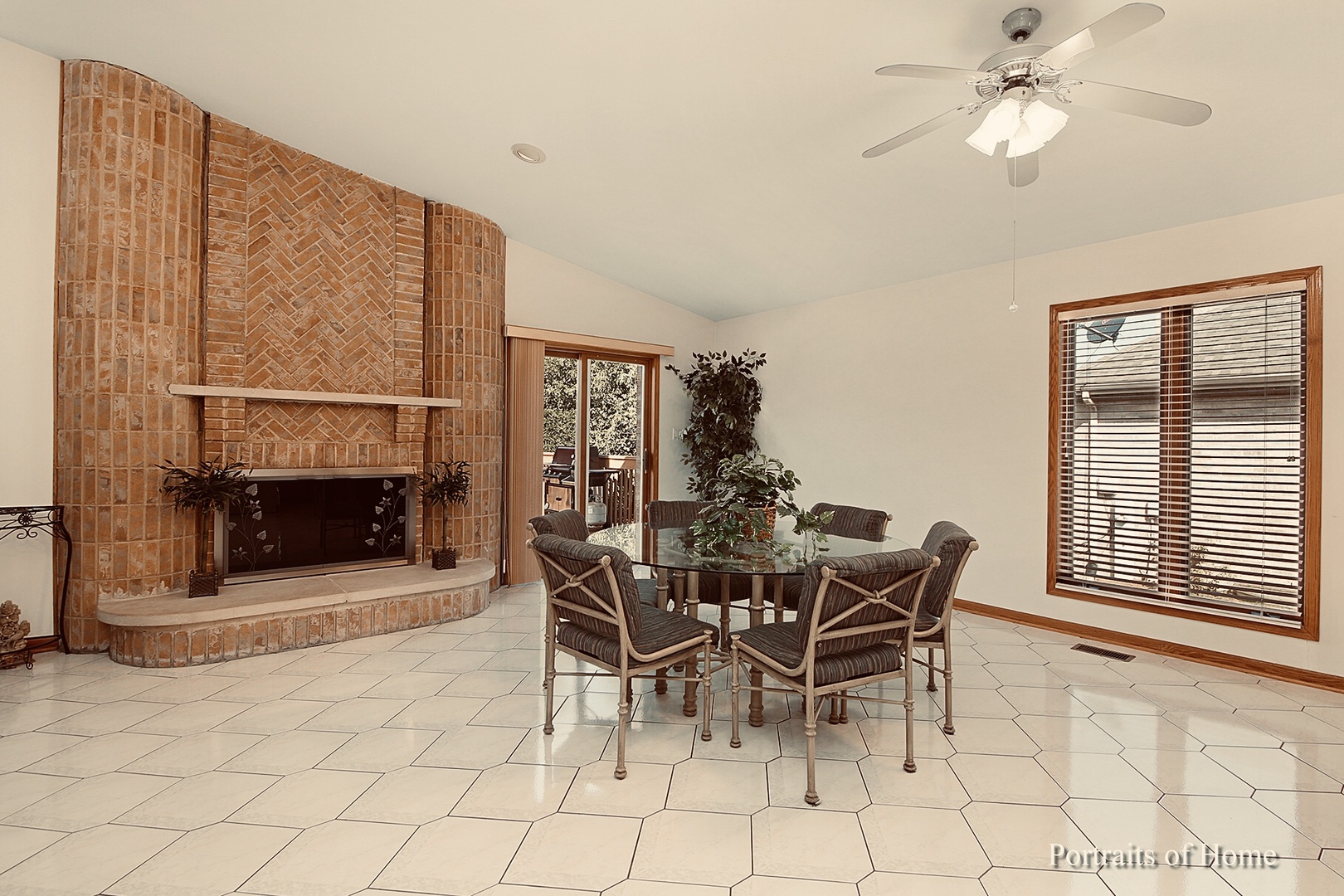 1220 Itasca Road Addison, IL 60101 - Photo 5 of 26 a dining room with furniture and a fireplace
