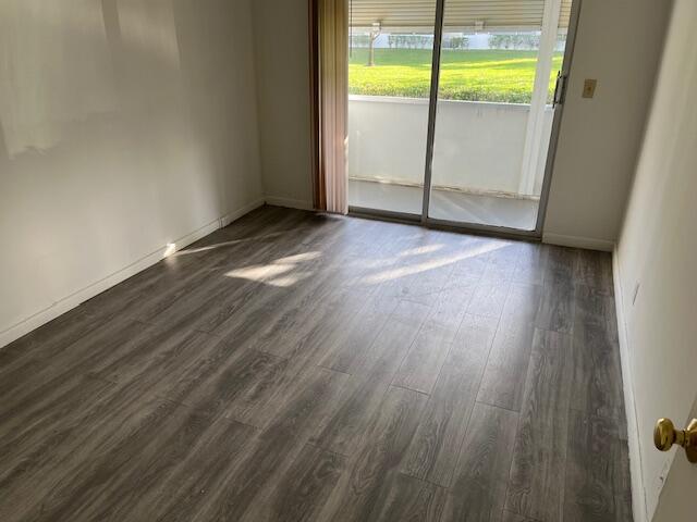 266 Brighton G, Unit 266 Boca Raton, FL 33434 - Photo 11 of 15 a view of a room with wooden floor