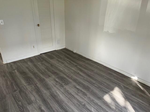 266 Brighton G, Unit 266 Boca Raton, FL 33434 - Photo 12 of 15 a view of empty room with wooden floor