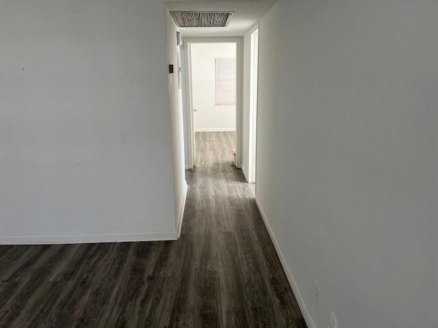 266 Brighton G, Unit 266 Boca Raton, FL 33434 - Photo 6 of 15 a view of a hallway with wooden floor