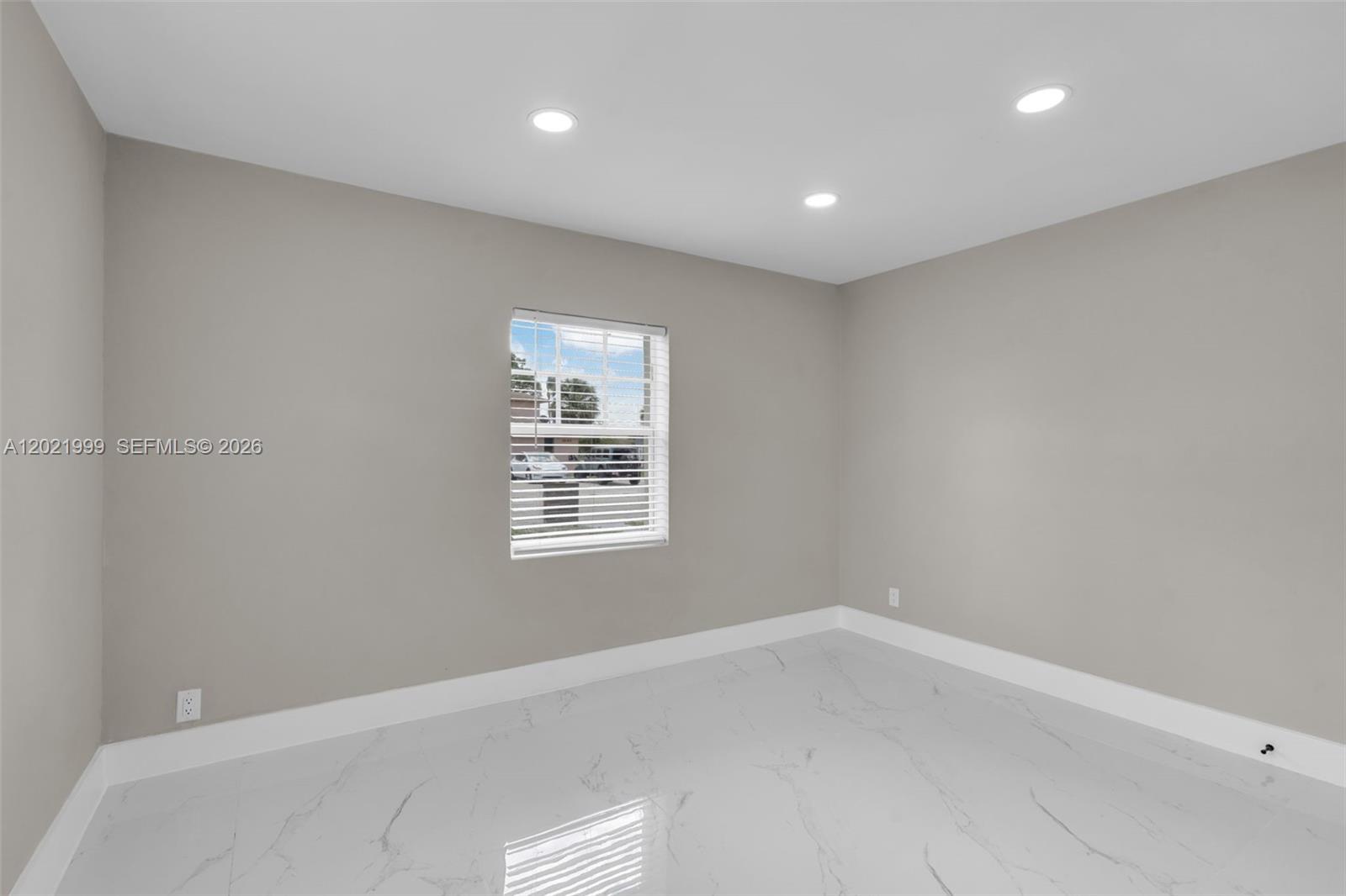 1660 West 26th Street Riviera Beach, FL 33404 - Photo 16 of 28 an empty room with a window