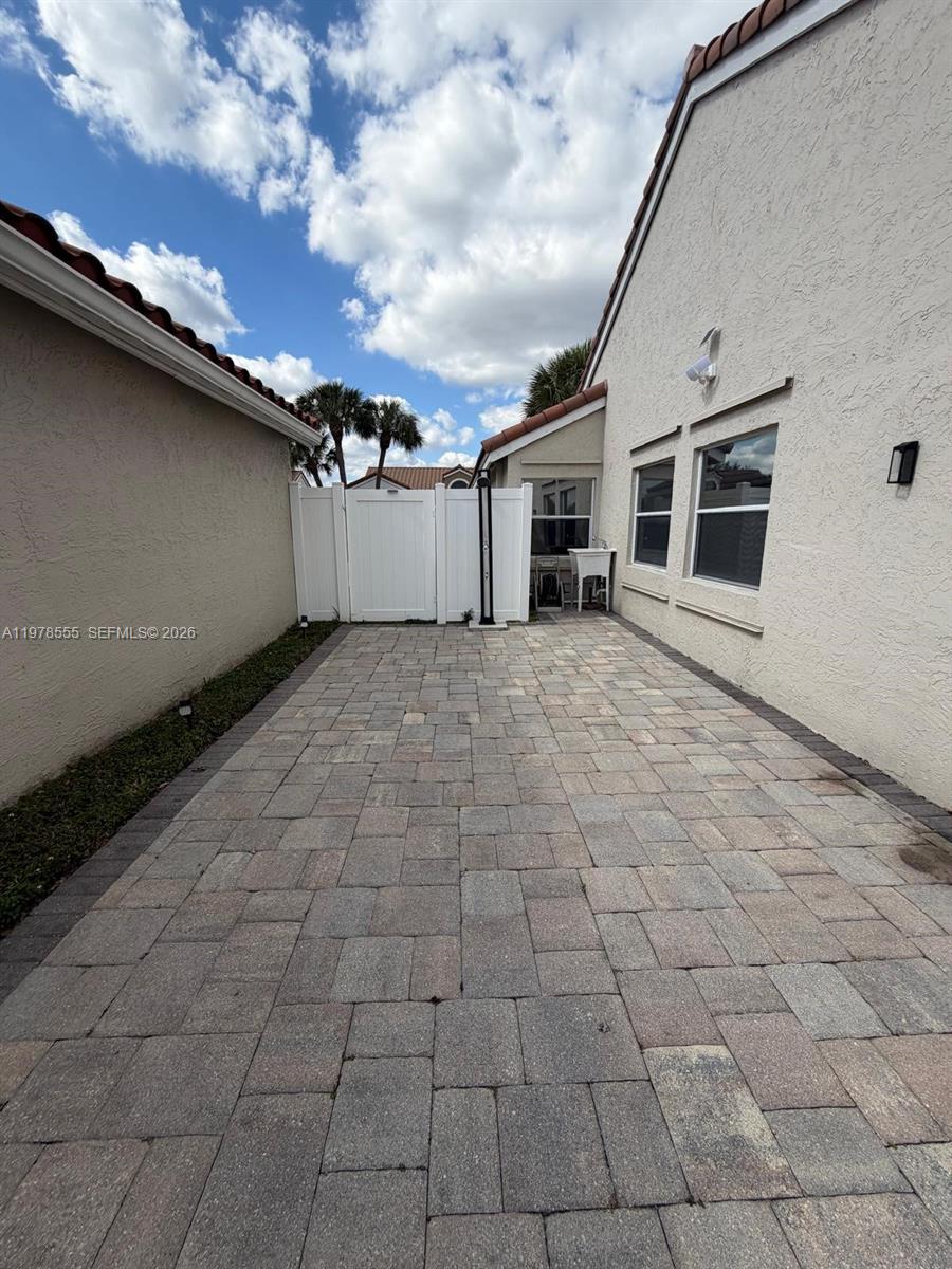10285 Allegro Drive Boca Raton, FL 33428 - Photo 46 of 55 a view of a house with a yard