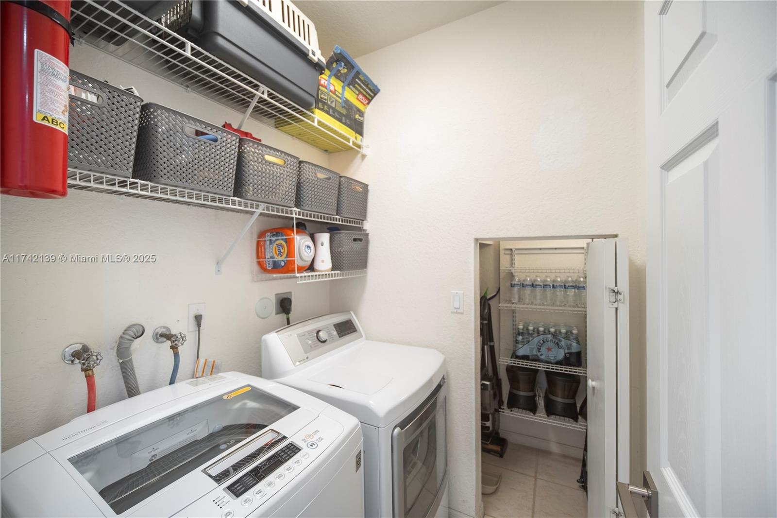 15929 Southwest 141st Terrace Miami, FL 33196 - Photo 18 of 41 a utility room with dryer and washer