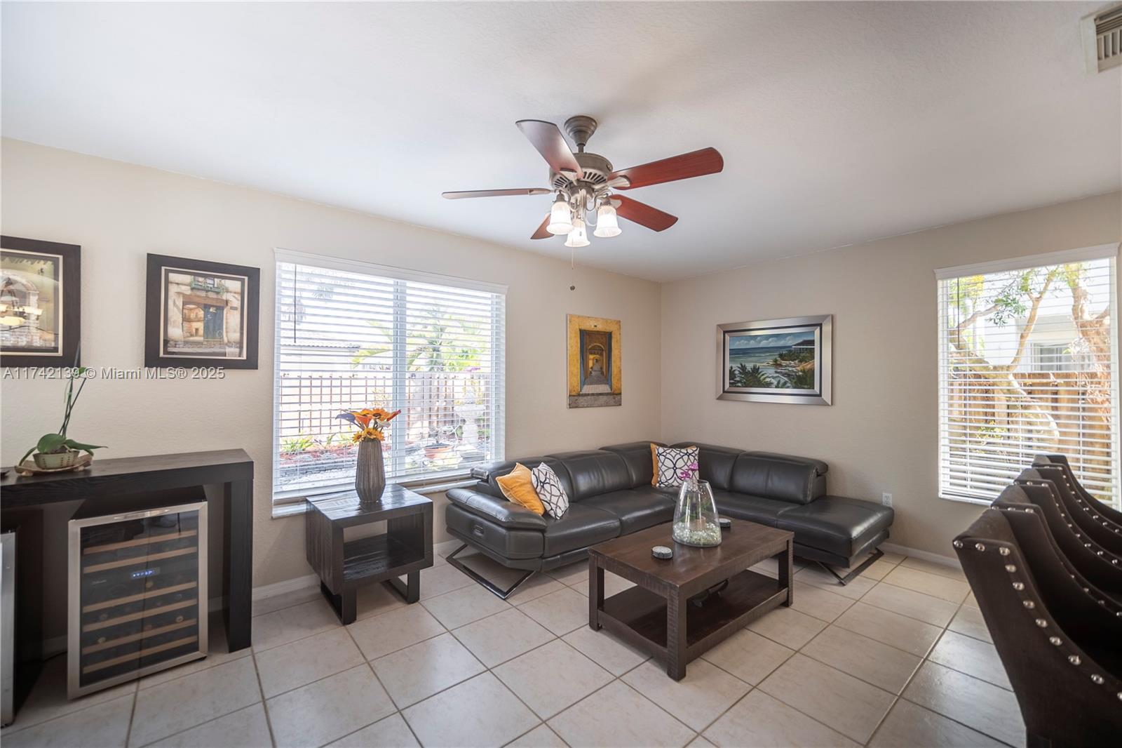 15929 Southwest 141st Terrace Miami, FL 33196 - Photo 20 of 41 a living room with furniture and a window