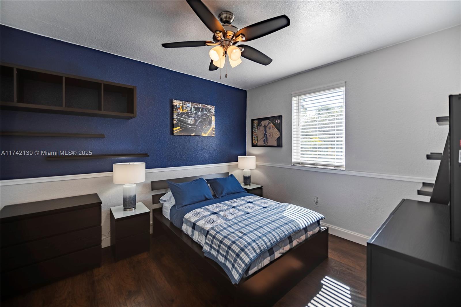 15929 Southwest 141st Terrace Miami, FL 33196 - Photo 31 of 41 a bedroom with a bed and a window
