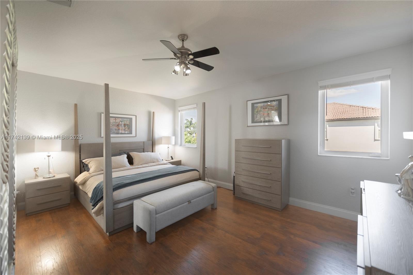 15929 Southwest 141st Terrace Miami, FL 33196 - Photo 39 of 41 a spacious bedroom with a bed and a window