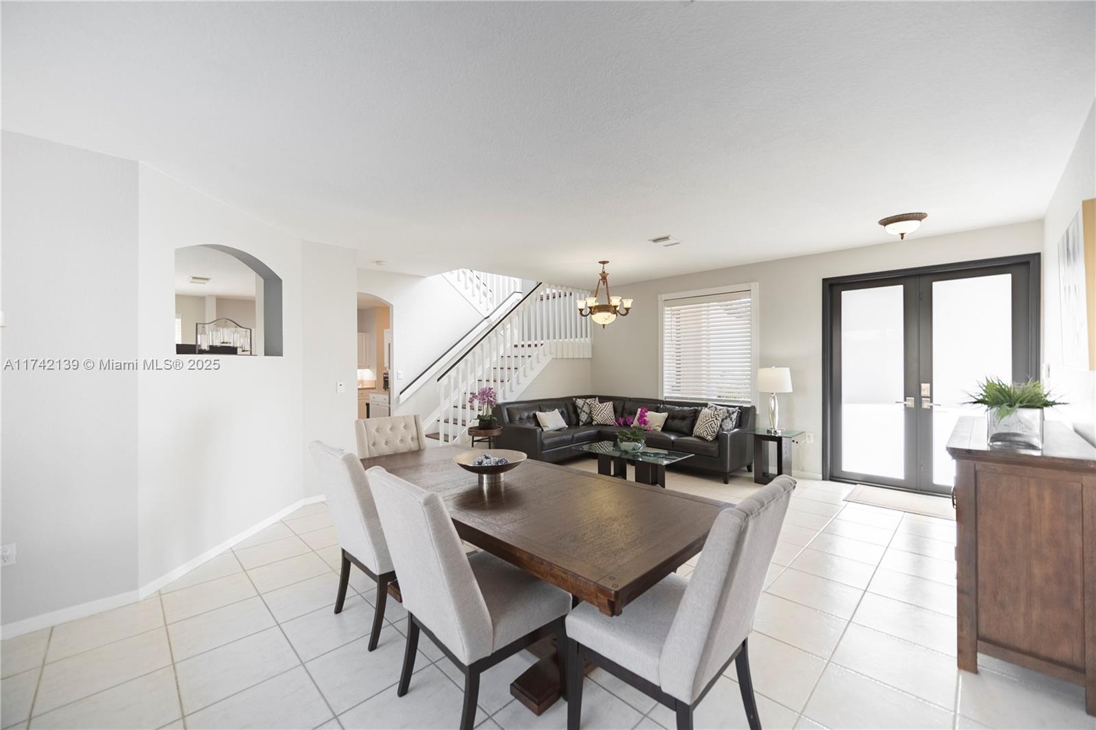 15929 Southwest 141st Terrace Miami, FL 33196 - Photo 10 of 41 a view of a dining room with furniture and wooden floor