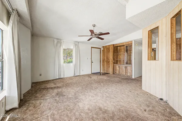a view of an empty room with a window