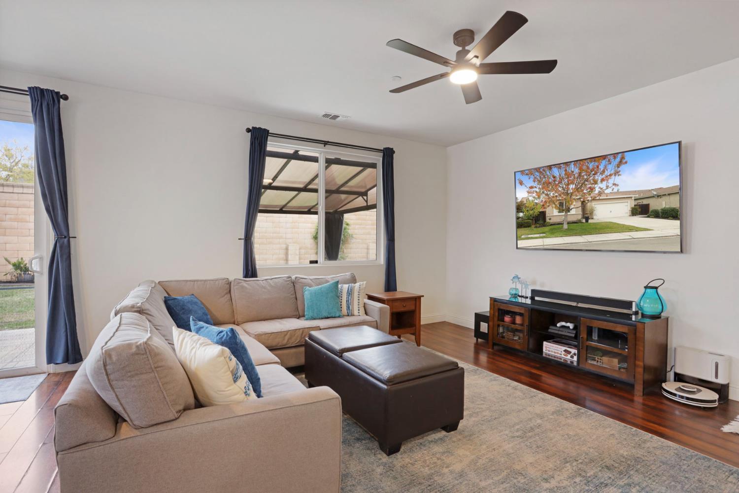 1091 Alba Street Manteca, CA 95337 - Photo 20 of 37 a living room with furniture a ceiling fan and a window