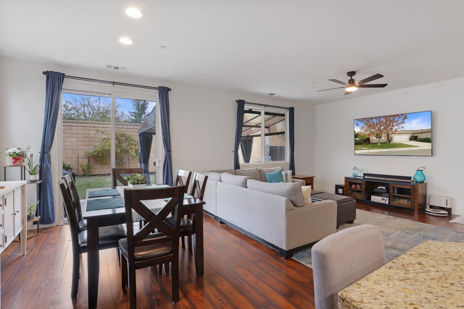 1091 Alba Street Manteca, CA 95337 - Photo 23 of 37 a living room with furniture a table and a large window