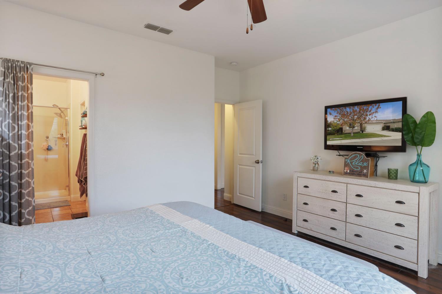 1091 Alba Street Manteca, CA 95337 - Photo 28 of 37 a living room with furniture and a flat screen tv