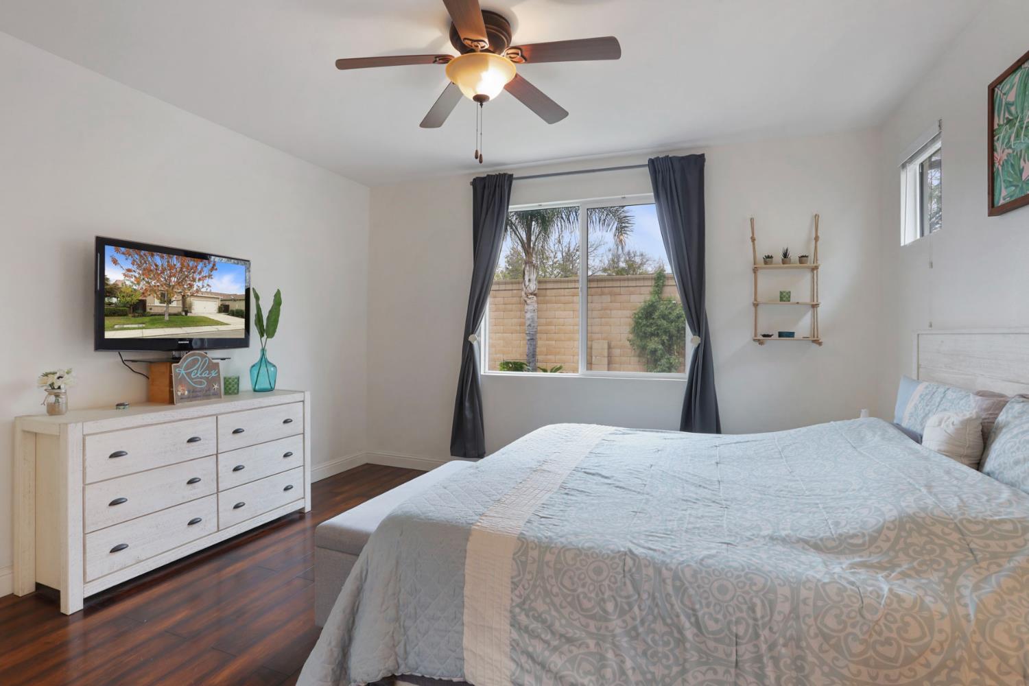 1091 Alba Street Manteca, CA 95337 - Photo 31 of 37 a bedroom with a bed dresser and a window