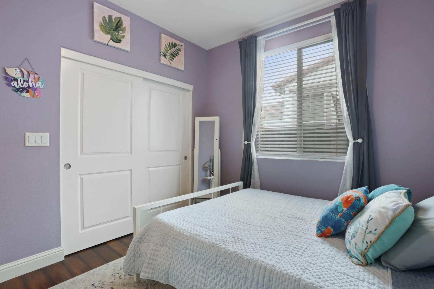1091 Alba Street Manteca, CA 95337 - Photo 9 of 37 a bedroom with a bed and a window