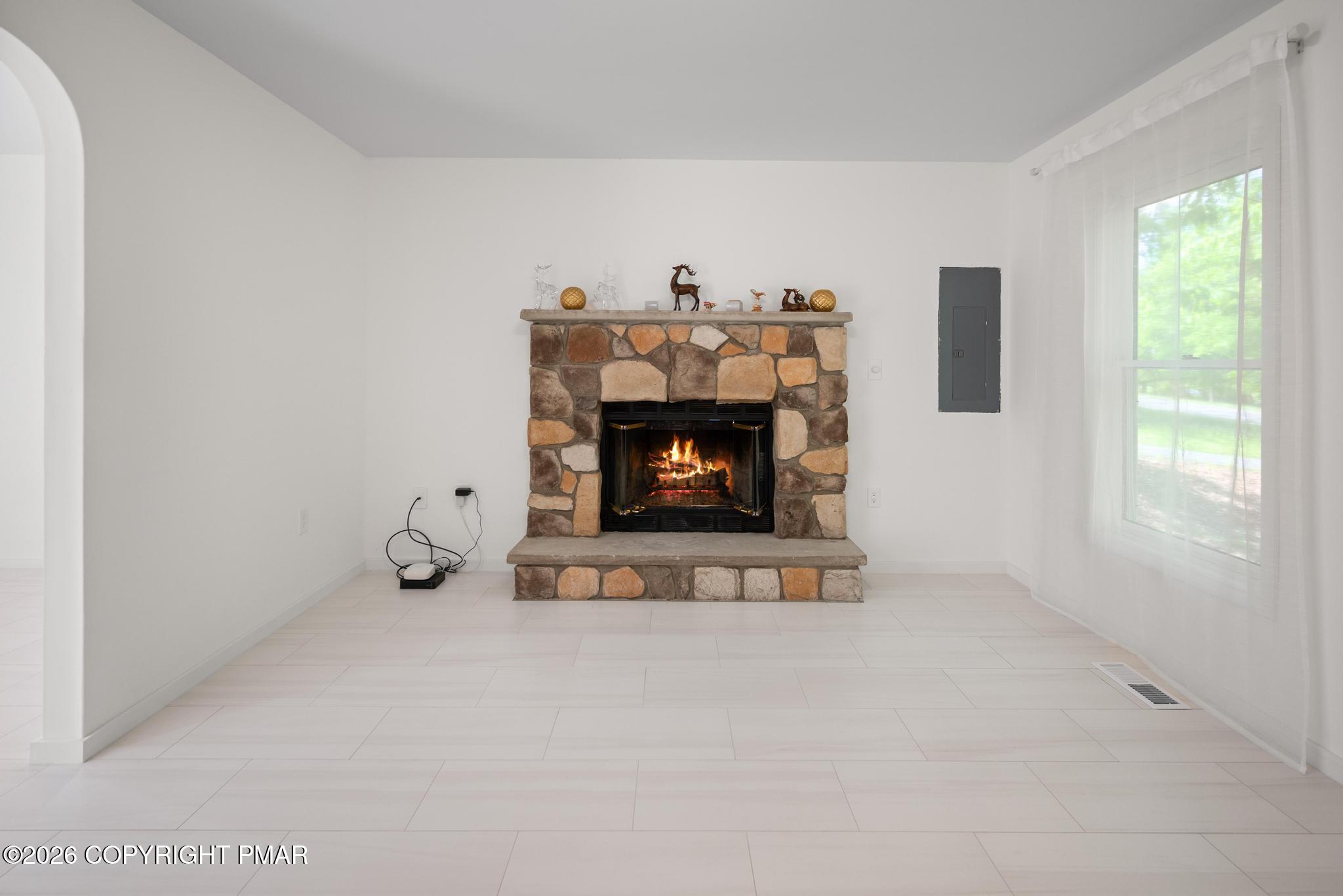 2312 Cramer Court Bushkill, PA 18324 - Photo 18 of 37 a room with a fireplace