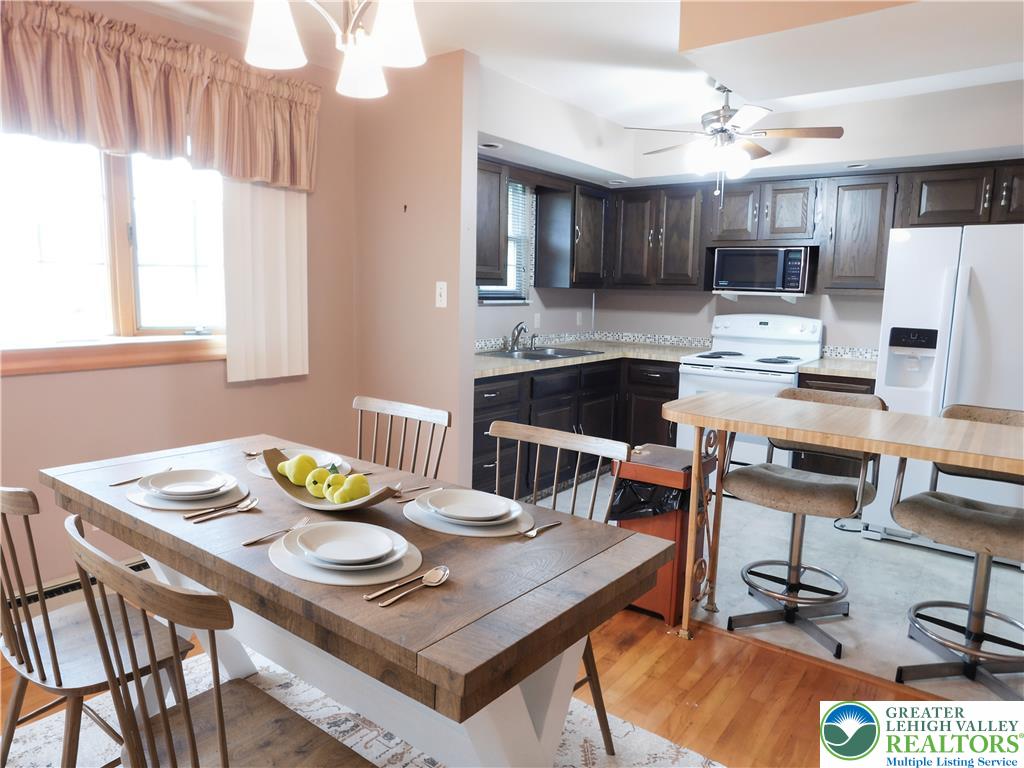 21 Will Barnesville, PA 18214 - Photo 9 of 23 A well-lit dining area flows seamlessly into a functional kitchen, ready for daily living.