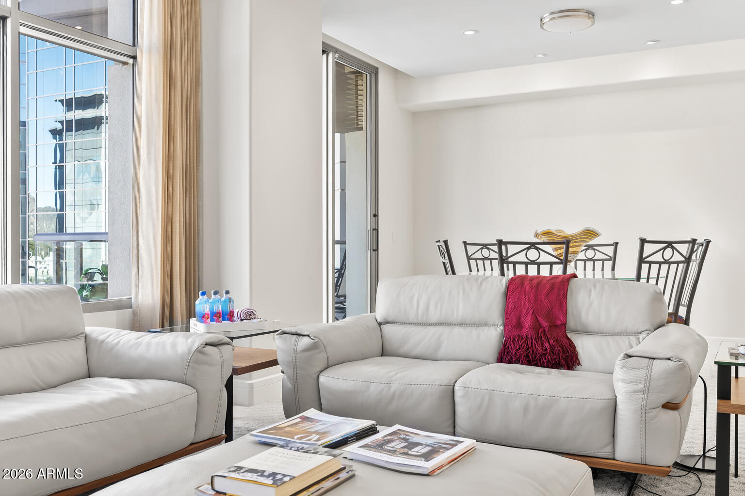 2402 East Esplanade Lane, Unit 704 Phoenix, AZ 85016 - Photo 12 of 42 a living room with furniture and a large window