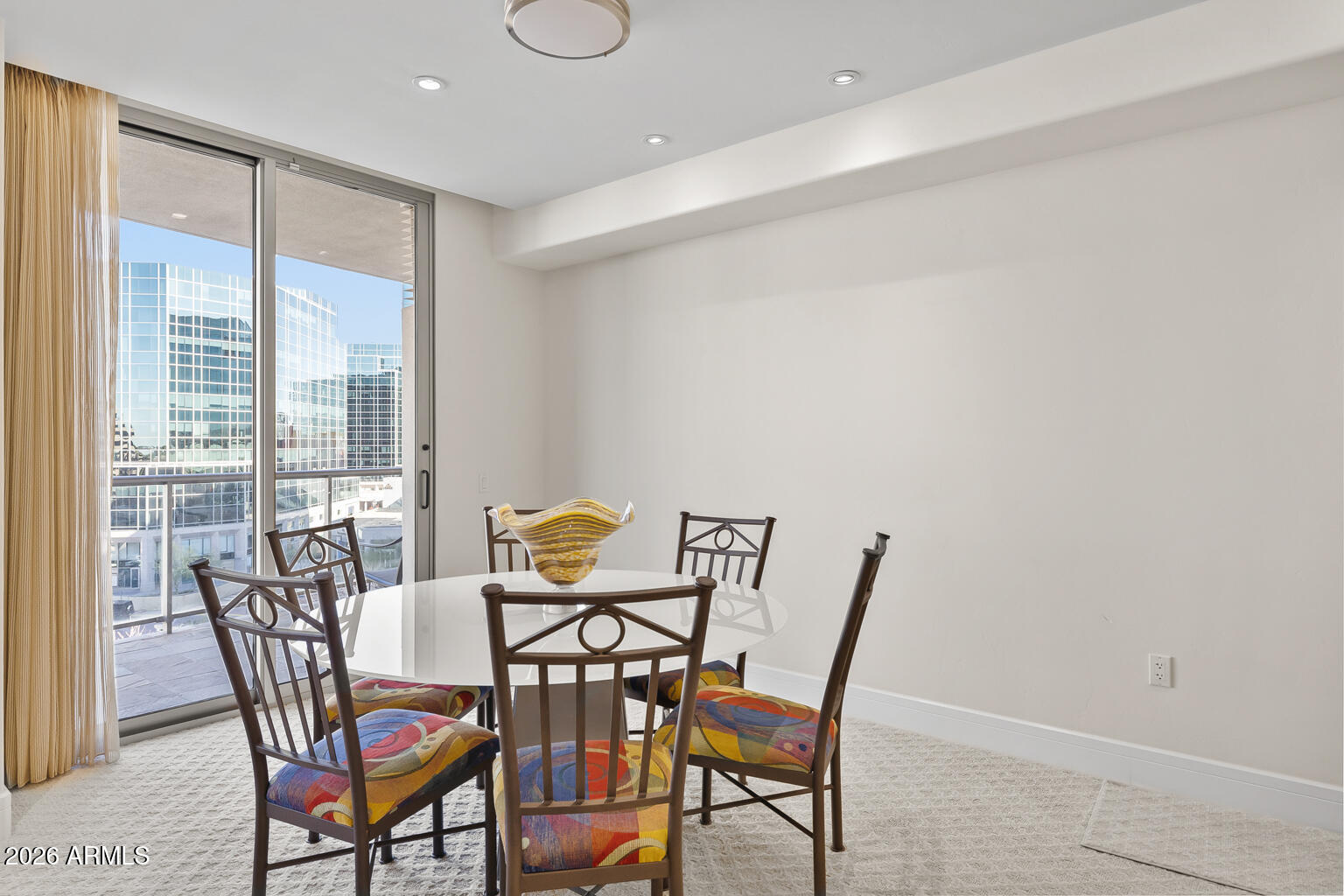 2402 East Esplanade Lane, Unit 704 Phoenix, AZ 85016 - Photo 13 of 42 a view of a dining room with furniture window and outside view