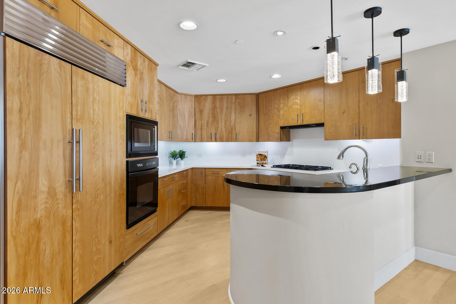 2402 East Esplanade Lane, Unit 704 Phoenix, AZ 85016 - Photo 14 of 42 a kitchen with stainless steel appliances granite countertop a sink a stove and a refrigerator