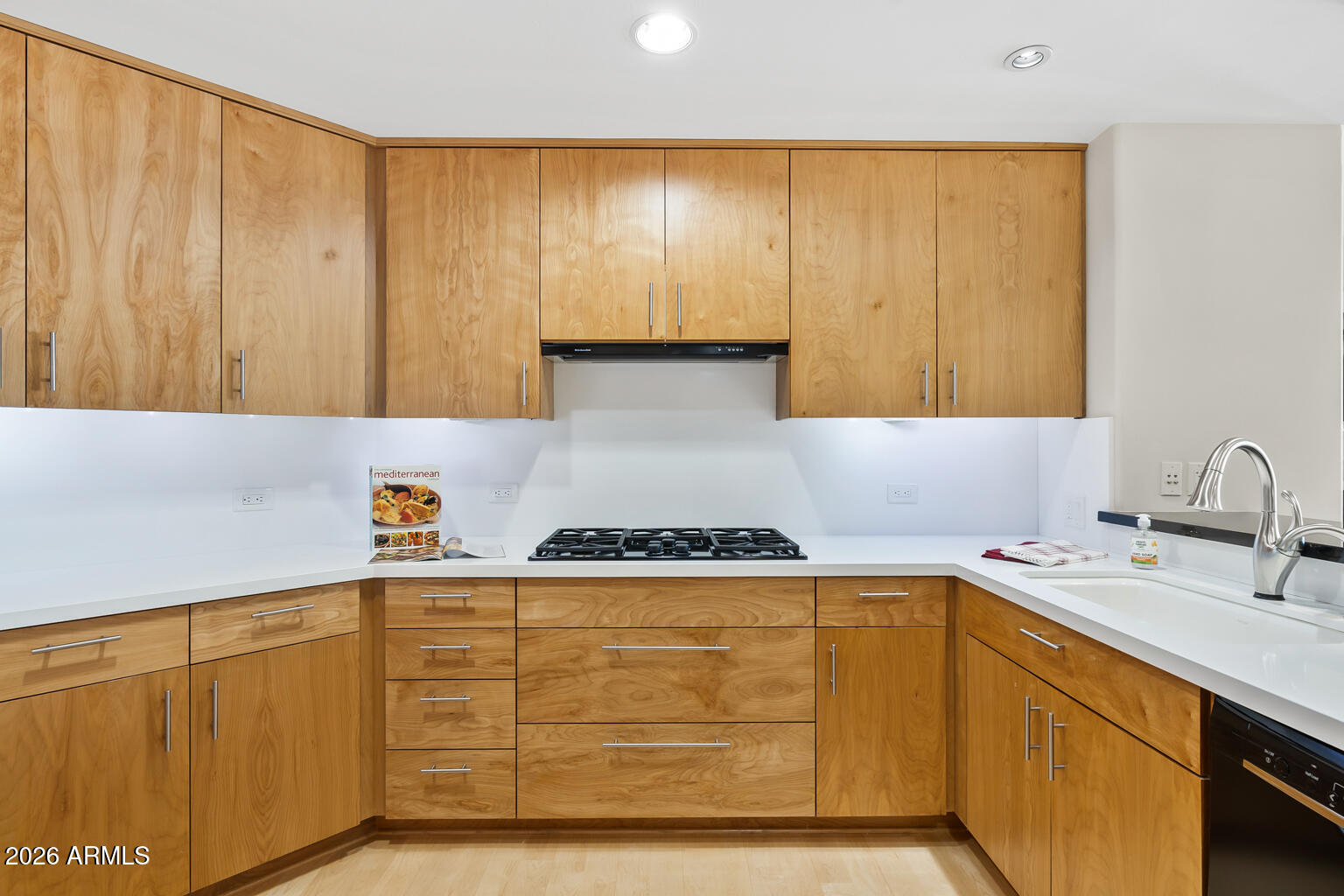 2402 East Esplanade Lane, Unit 704 Phoenix, AZ 85016 - Photo 16 of 42 a kitchen with cabinets a sink and a stove top oven