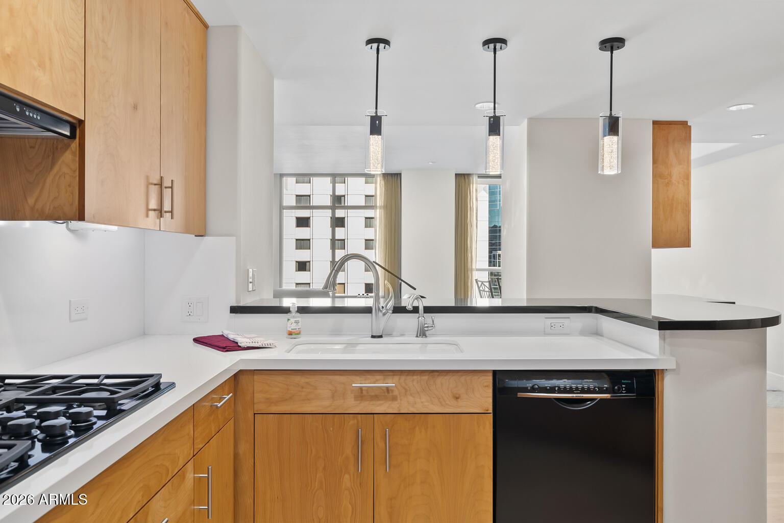 2402 East Esplanade Lane, Unit 704 Phoenix, AZ 85016 - Photo 17 of 42 a kitchen with stainless steel appliances granite countertop a sink stove and refrigerator