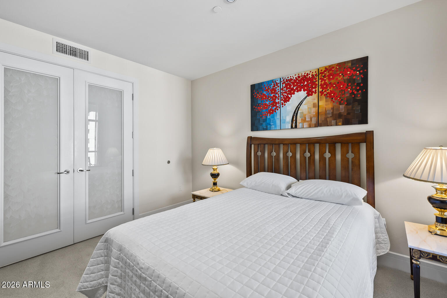 2402 East Esplanade Lane, Unit 704 Phoenix, AZ 85016 - Photo 21 of 42 a bedroom with a bed and a painting on the wall