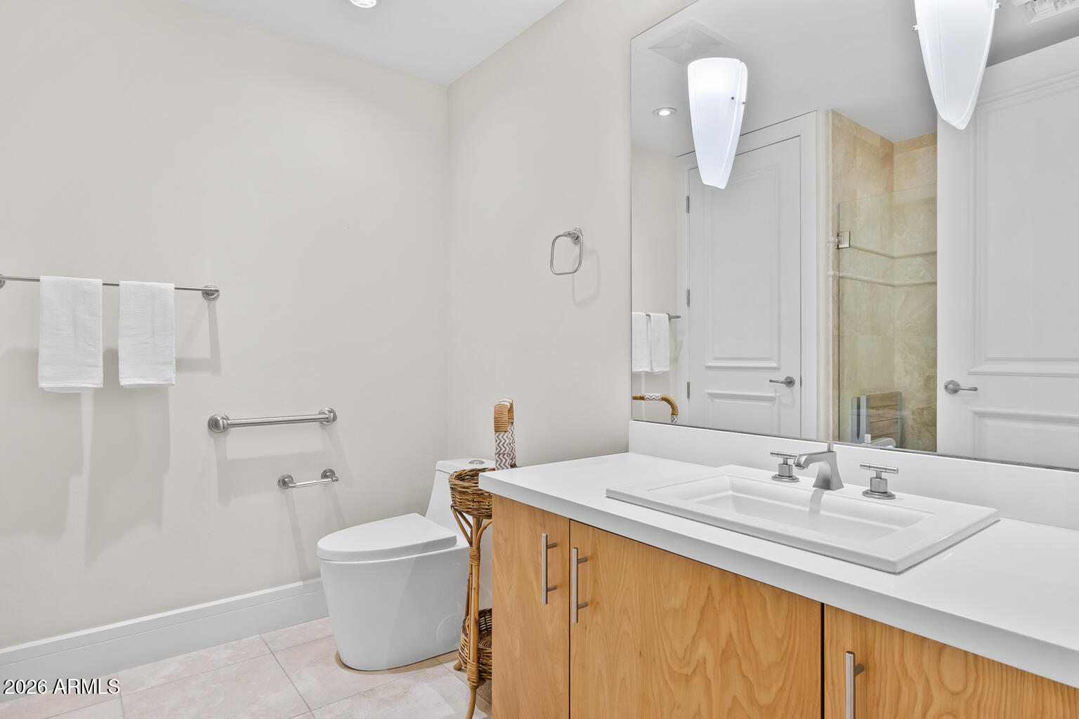 2402 East Esplanade Lane, Unit 704 Phoenix, AZ 85016 - Photo 23 of 42 a bathroom with a sink toilet and shower