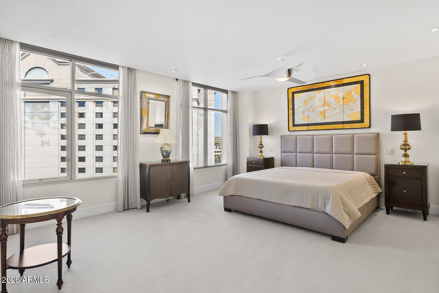 2402 East Esplanade Lane, Unit 704 Phoenix, AZ 85016 - Photo 28 of 42 a bedroom with a bed and a couch