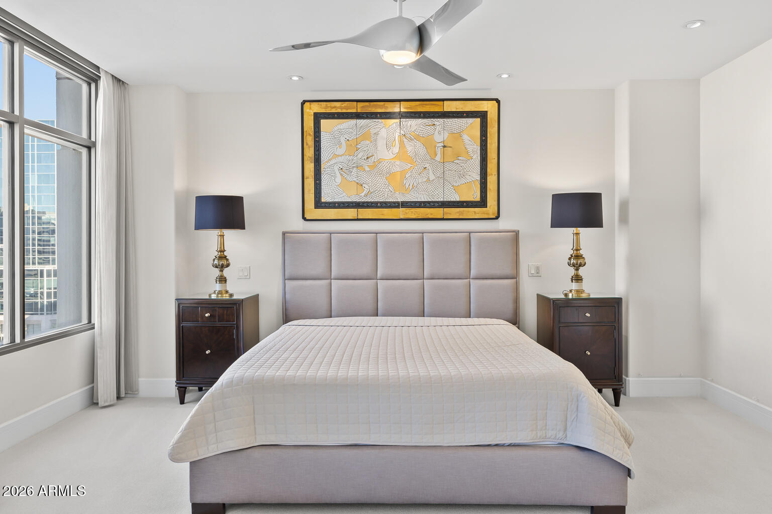 2402 East Esplanade Lane, Unit 704 Phoenix, AZ 85016 - Photo 29 of 42 a bedroom with a bed and a painting on the wall