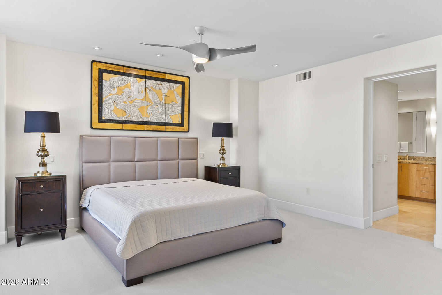 2402 East Esplanade Lane, Unit 704 Phoenix, AZ 85016 - Photo 30 of 42 a bedroom with a bed and a painting on the wall